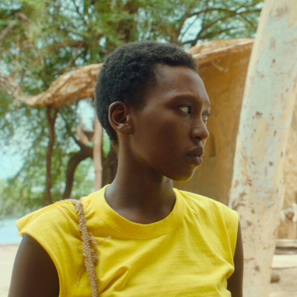 A woman in a yellow shirt.
