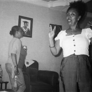 Two women standing in a room.